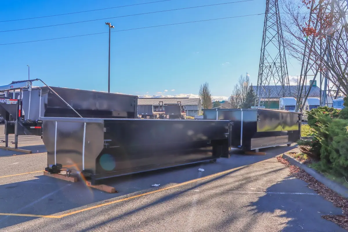 Roll-off dumpster ready for waste disposal at job site for 2 Yard Dumpster Rental in Fayetteville